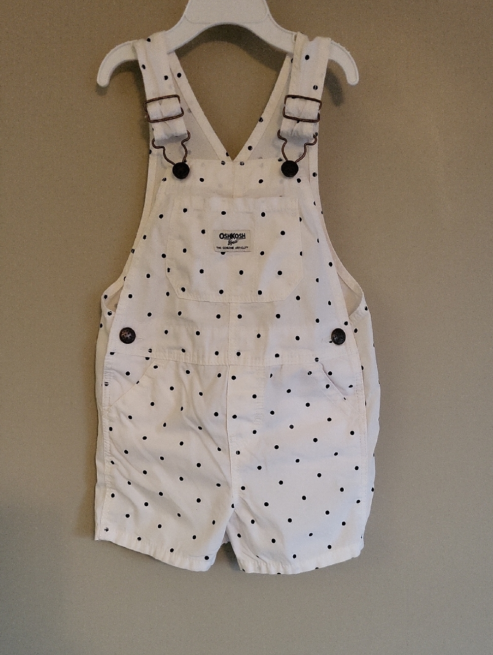 OshKosh B'gosh cream shortalls with navy polka dots